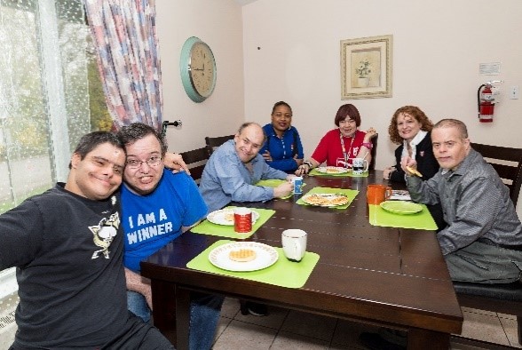 Group of residents around dining table