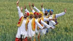 6 Indian men dancing in a field